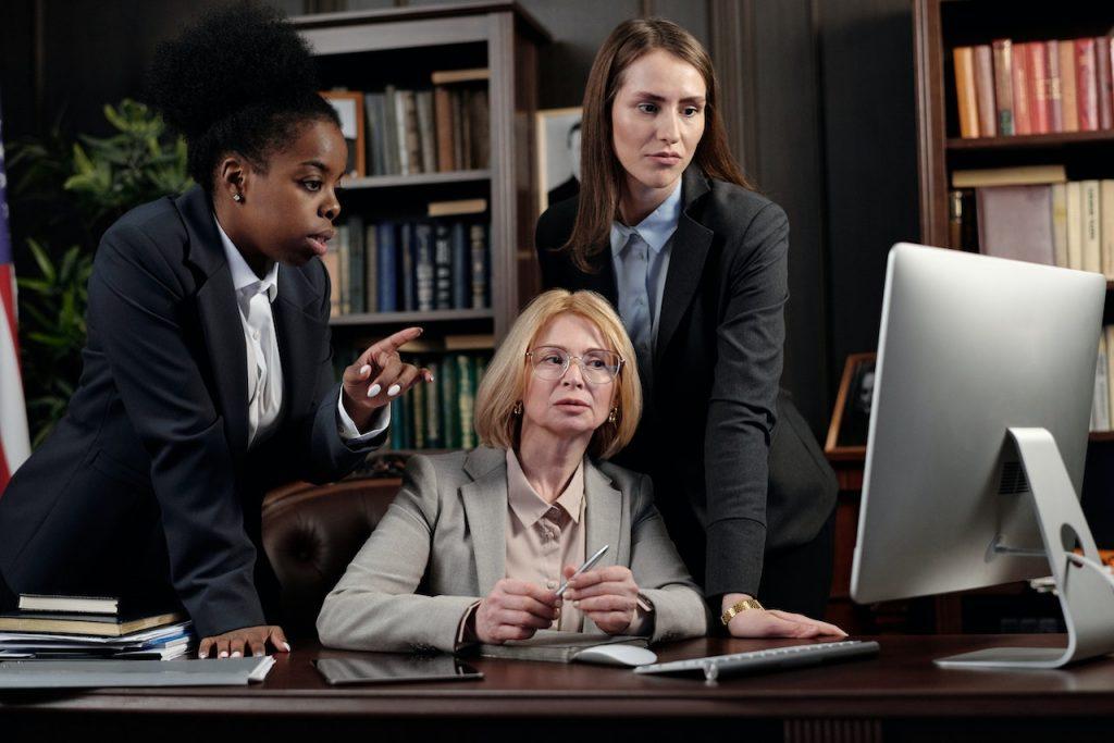 Lawyers in an Office Looking at a Computer