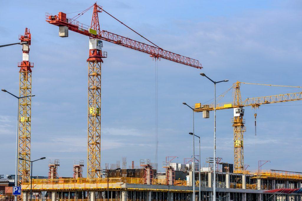 three cranes on a building site