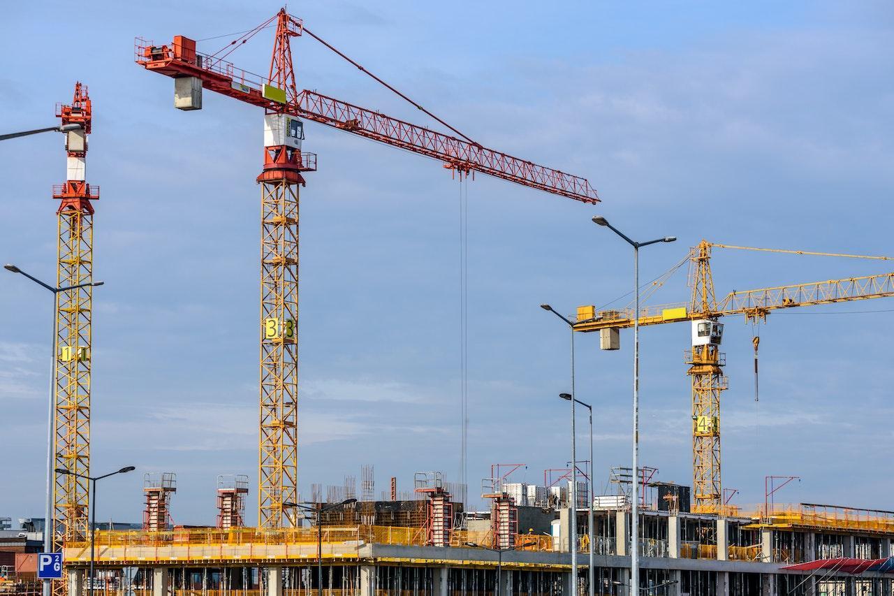 three cranes on a building site