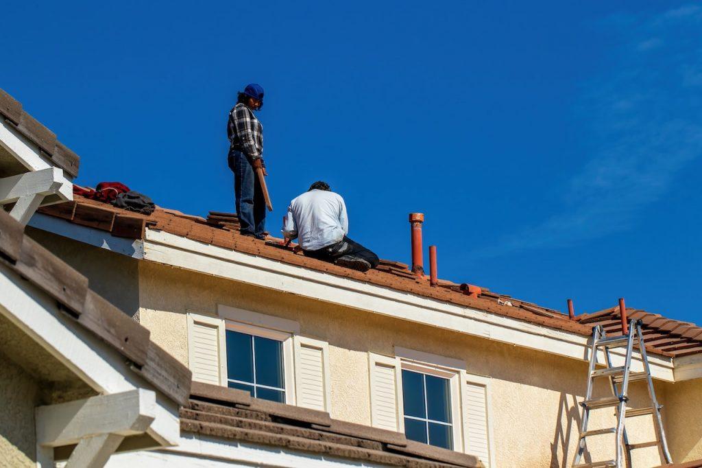 two workers on roof
